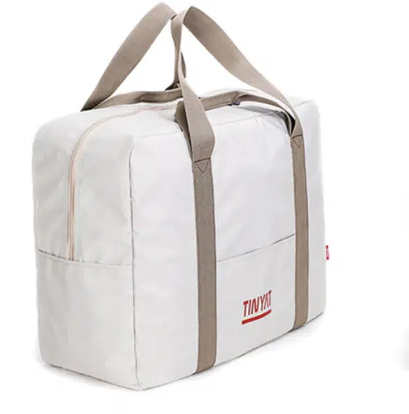 Sac pliable et imperméable adaptable sur une valise – Blanc
