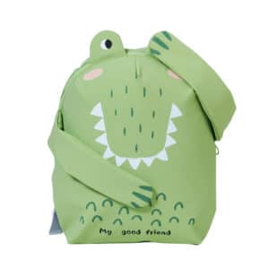 Petit sac à dos pour enfant en forme de petit croco vert avec ses pattes qui sont rabattues sur son ventre pour l'une et l'autre sur son œil